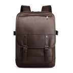 A dark brown faux leather retro backpack with a top zip pocket, front flap, and buckle straps against a white background.
