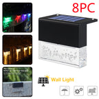 Eight-pack of waterproof, black solar LED fence lights with textured clear glass and RGB/warm light color options.