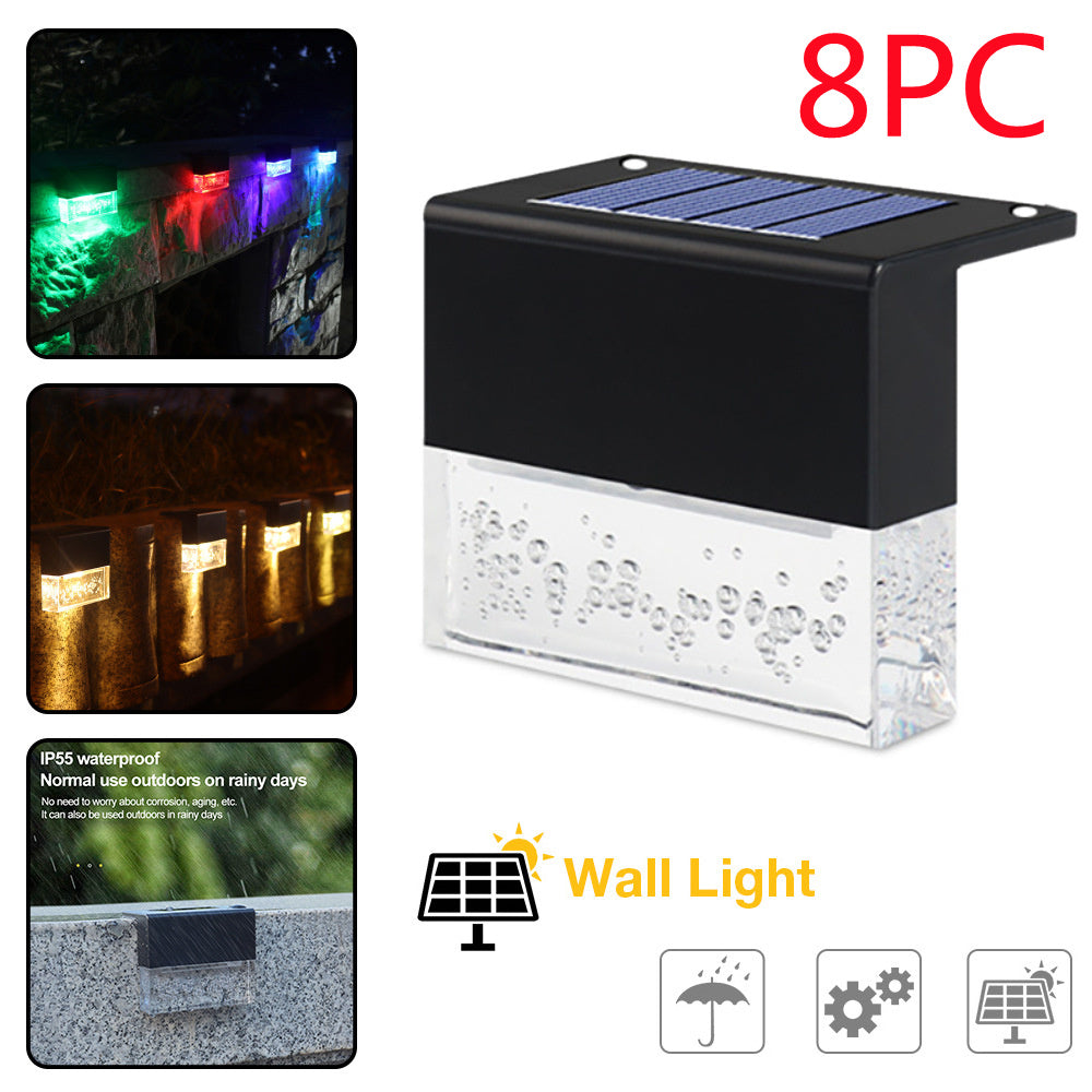 Eight-pack of waterproof, black solar LED fence lights with textured clear glass and RGB/warm light color options.