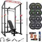 Black and red metal power cage with adjustable bench, barbell, various weight plates, and attachments for home workouts.
