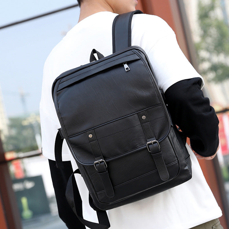 Digitaldistribution375 black leather retro backpack with top zipper, buckle-strap front pocket, and adjustable straps.