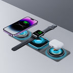 3-in-1 foldable charging station with glowing blue accents, charging an iPhone, Apple Watch, and white AirPods case.