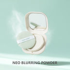 An open, cream-colored compact with a mirror and mint green powder puff, floating against a light green background.