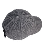 Grey cable-knit baseball cap with a textured wool design and an adjustable black strap closure.