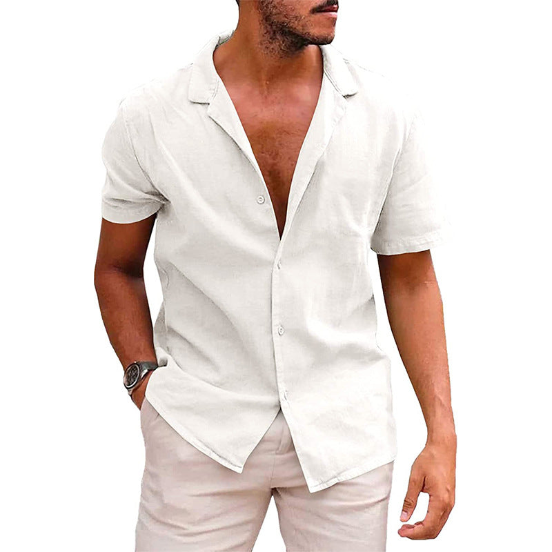 Model wearing a short-sleeve, white linen-style button-down shirt with an open camp collar for a casual beach look.