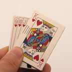 A metal windproof lighter shaped like a fan of playing cards, featuring a colorful King of Hearts design.