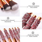 Digitaldistribution375: Makeup brush set with rose gold metal, ultra-soft white bristles, and pink diamond-inlaid handles.