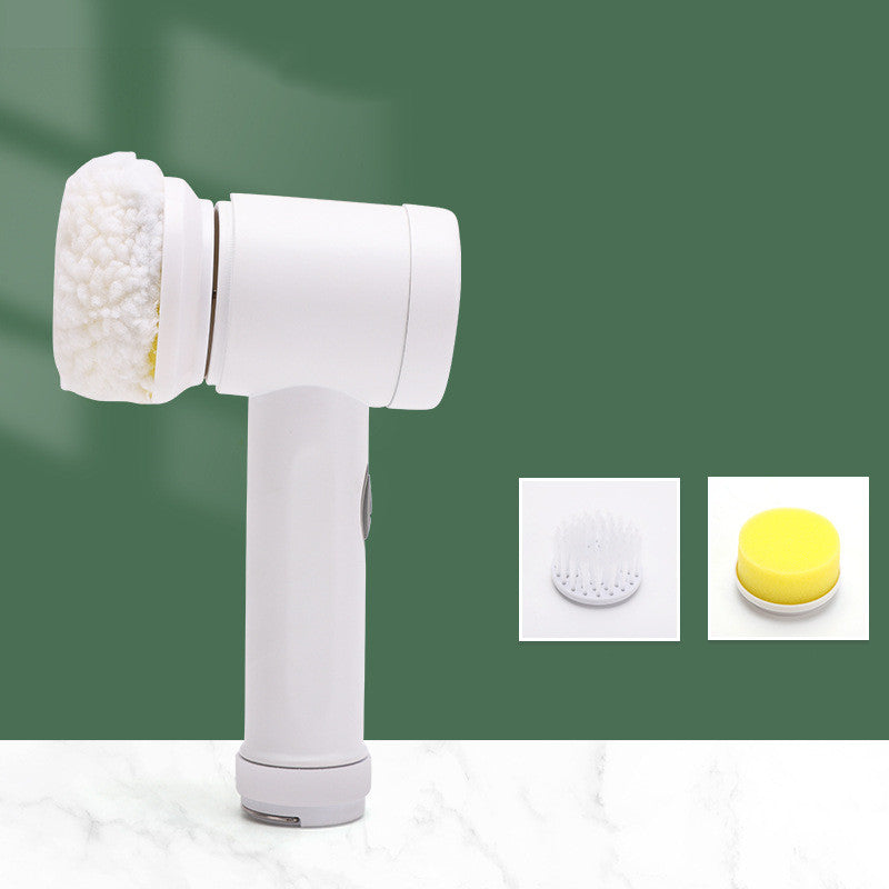 White electric household cleaning brush with a fuzzy head, plus interchangeable brush and yellow sponge attachments.