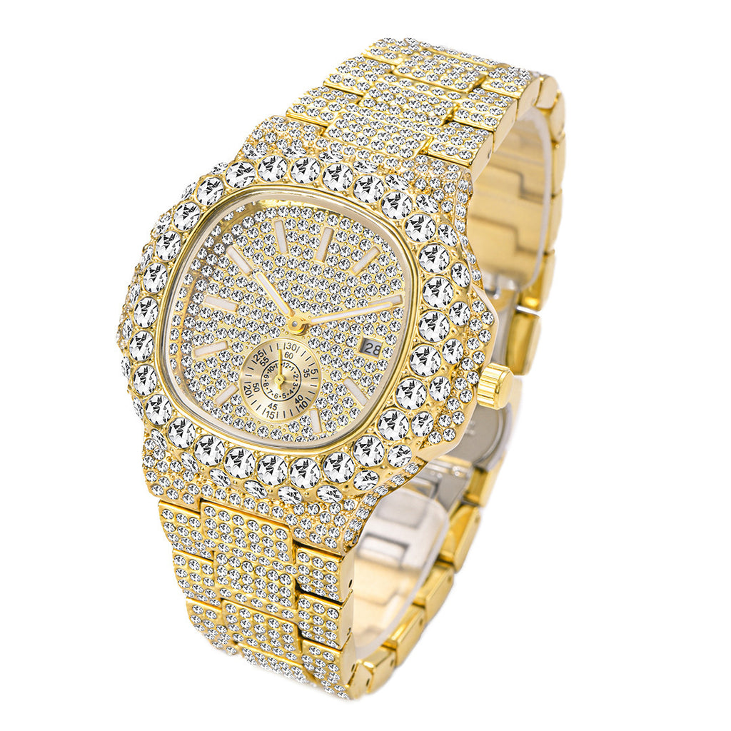 Gold-tone quartz watch fully encrusted with shimmering crystals, featuring a calendar dial and linked metal band.