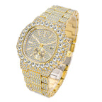 Gold-tone quartz watch fully encrusted with shimmering crystals, featuring a calendar dial and linked metal band.