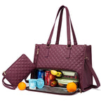 Quilted purple thermal lunch tote bag with matching purse, featuring an insulated base compartment filled with food.