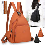 Orange waterproof nylon chest backpack with multiple pockets, zipper closures, and adjustable straps for casual use.