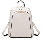 Minimalist cream leather backpack with top handle, dual zippers, and metallic front accent.