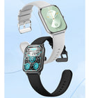 Two smartwatches with rectangular screens and silicone straps in white and black, displaying digital watch faces.