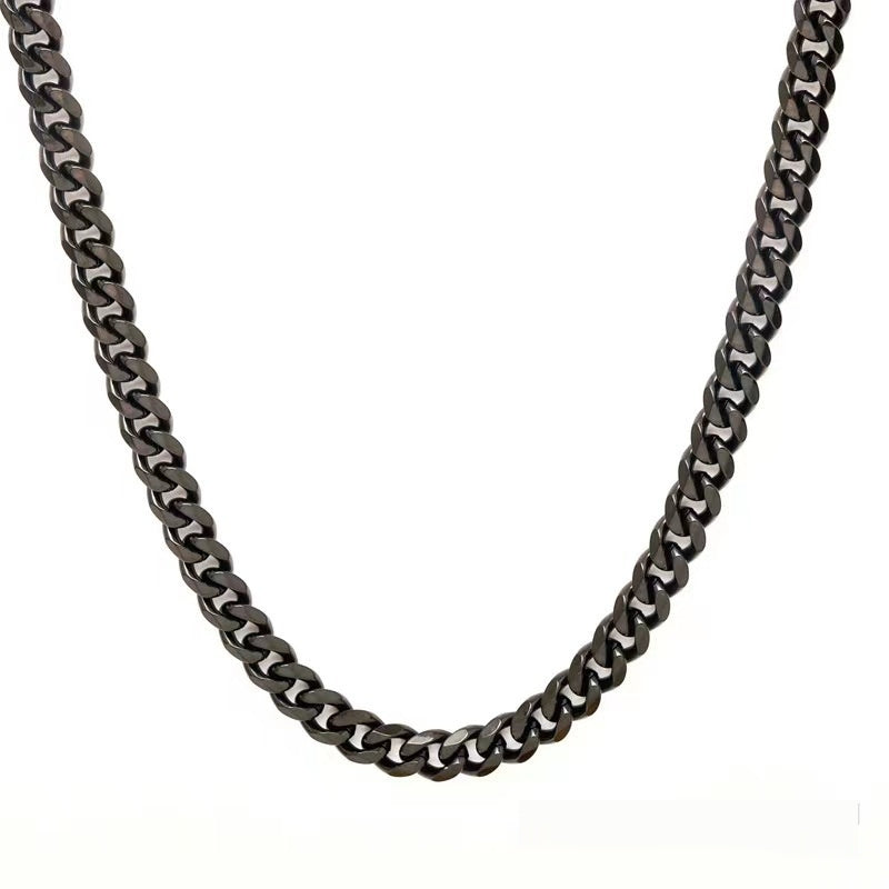 Gunmetal grey Cuban link chain necklace with a polished metallic finish, displayed against a white background.
