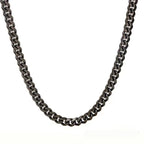 Gunmetal grey Cuban link chain necklace with a polished metallic finish, displayed against a white background.