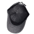 Interior view of a charcoal grey ribbed knit baseball cap with a black inner lining and an adjustable back strap.