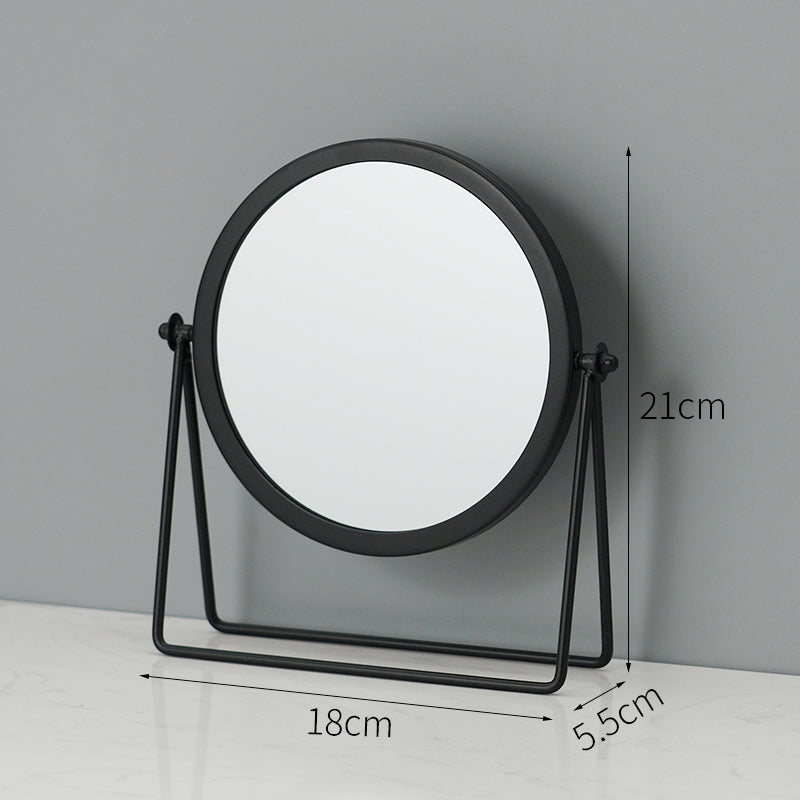Black round tabletop makeup mirror on a metal stand with 18cm x 21cm x 5.5cm dimensions.