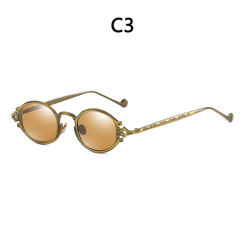 Round, vintage-style steampunk sunglasses with ornate gold-toned metal frames and brown-tinted lenses.