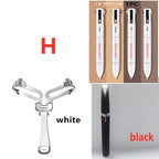 Eyebrow shaping set featuring a foldable white stencil, 4-in-1 contouring pens, and a sleek black precision trimmer.