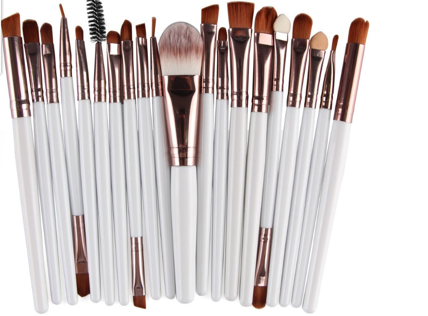 A set of Digitaldistribution375 makeup brushes with white handles, rose gold ferrules, and soft brown synthetic bristles.