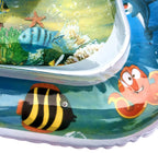 Inflatable baby water mat with colorful cartoon ocean theme, featuring floating sea creatures on a blue background.