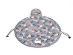 Round, grey floral cosmetic bag by Digitaldistribution375 with a drawstring closure and a velcro-secured flap.