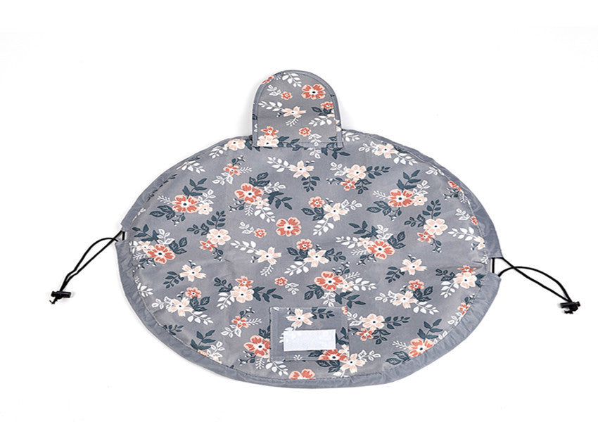 Round, grey floral cosmetic bag by Digitaldistribution375 with a drawstring closure and a velcro-secured flap.