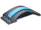 Black curved lumbar traction device with acupressure nubs and a central blue foam pad on a white background.