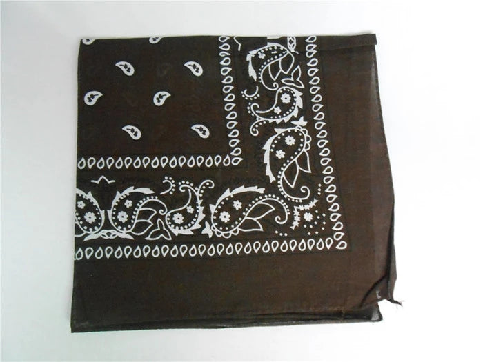 A dark brown square bandana featuring a classic white paisley and floral print with a patterned border.