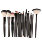 Digitaldistribution375 set of 18 black-handled makeup brushes with soft, two-toned synthetic bristles.