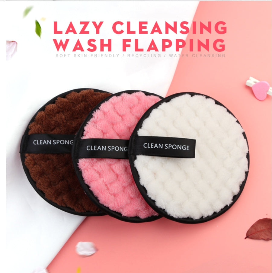 Three round, fuzzy, textured cleansing sponges in brown, pink, and white with black "CLEAN SPONGE" labels.