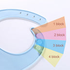 Light blue silicone baby bib with an adjustable four-setting snap closure system shown on a white background.