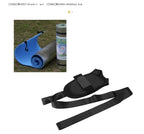 Black fabric foot drop rehabilitation strap with adjustable velcro and long tension belts, next to a blue yoga mat.