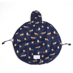 Navy blue cosmetic bag with orange fox print, round flat-lay design, drawstring closure, and a velcro pouch pocket.