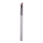 An angled brow makeup brush with a sleek silver handle and synthetic brown bristles, isolated on a white background.