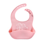 Light pink silicone baby bib with an elephant print and a large food-catching pocket, featuring an adjustable strap.