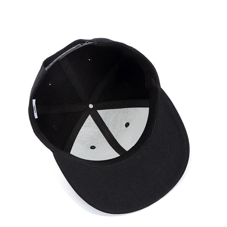 Interior view of a black flat-brim baseball cap, showing fabric lining, sewn seams, and an adjustable snapback strap.