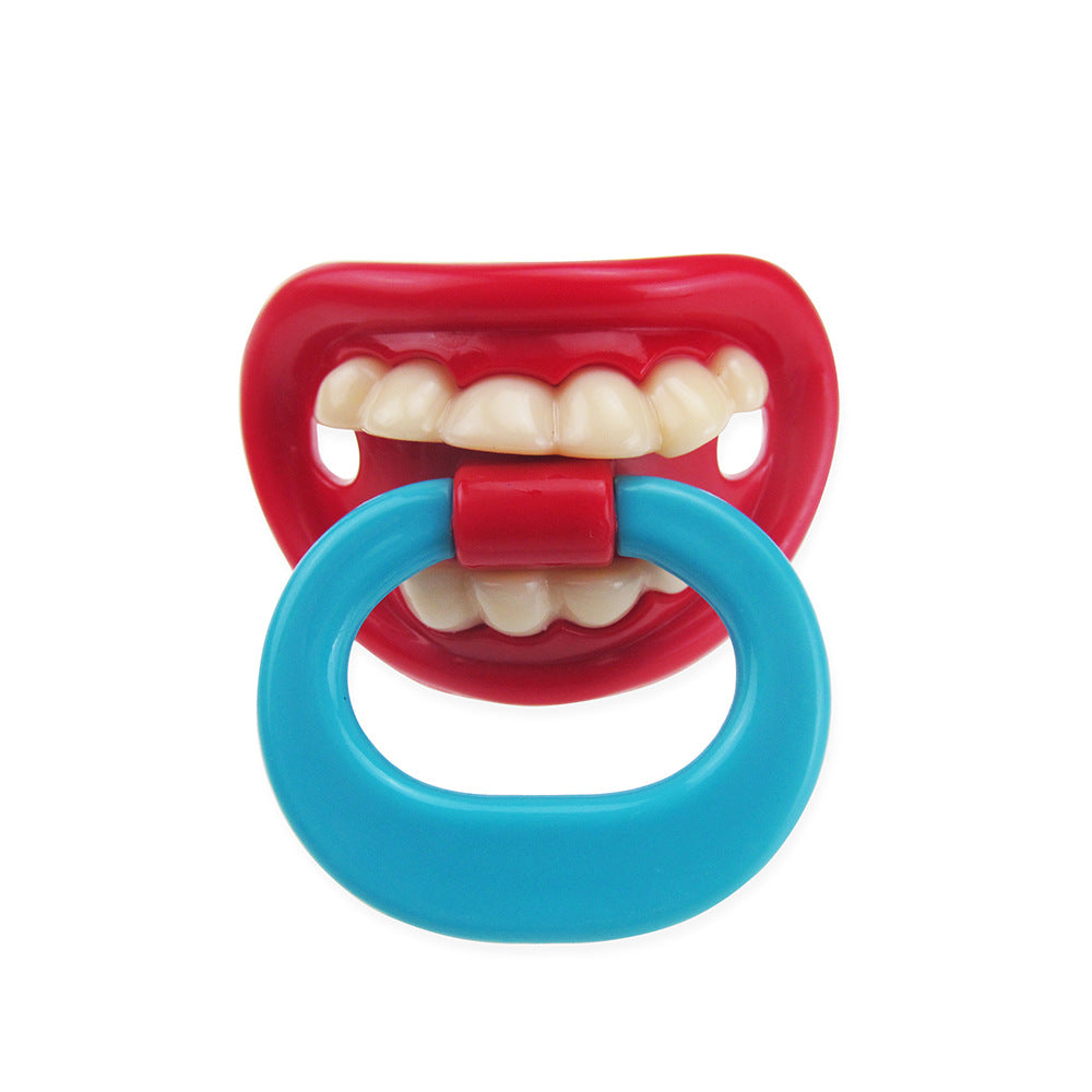 Funny baby pacifier with a red mouth, white teeth design, and a bright blue ring handle on a white background.