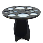 Black, 14-hole circular makeup brush drying rack with silicone inserts and a sturdy, intersecting stand base.