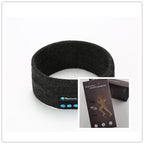 Dark gray fabric Bluetooth sports headband with integrated music controls, shown with its retail packaging box.