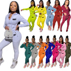 Women wearing slim-fit, zippered hooded tracksuits featuring "BODY" letter prints in various solid colors.