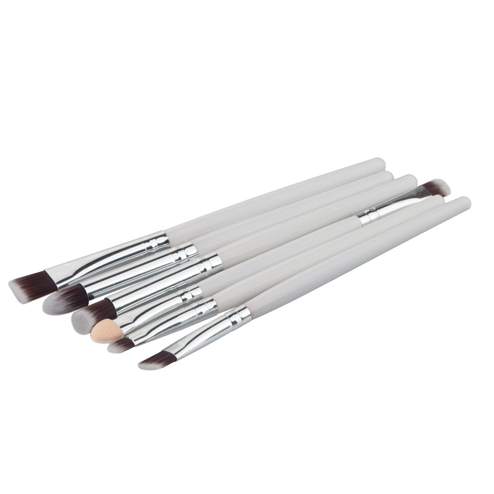 A set of 6 eye makeup brushes featuring white handles, silver ferrules, and soft brown and white synthetic bristles.