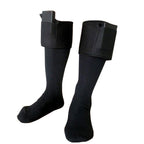 Pair of black knit electric heated socks with attached rectangular battery packs at the top cuffs. Isolated on white.
