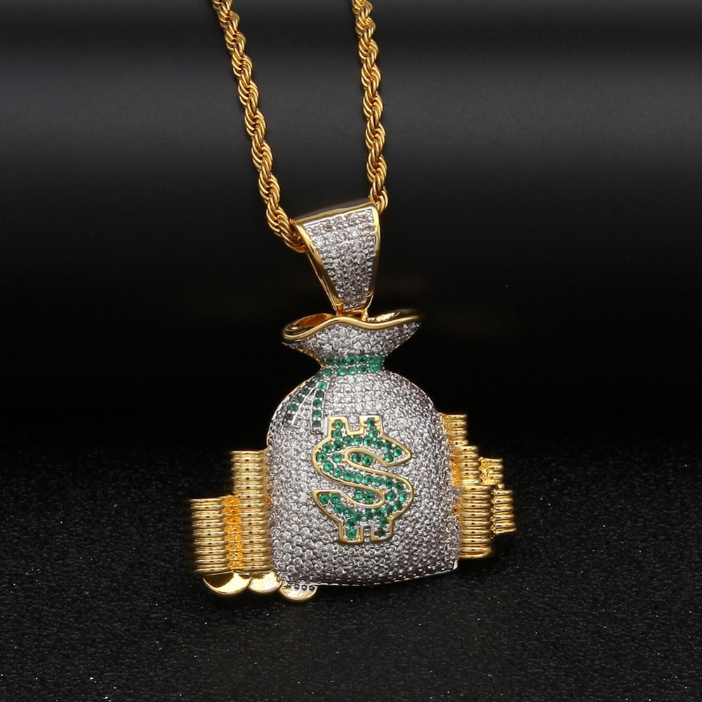 Gold rope chain with an iced-out money bag pendant featuring white stones, a green dollar sign, and gold-tone accents.