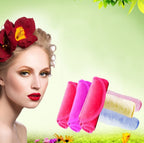 A woman with a red flower in her hair next to a stack of soft, colorful microfiber makeup remover towels.