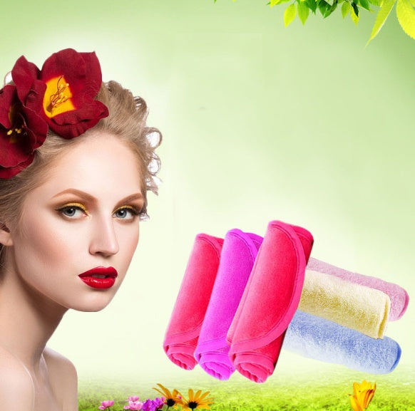 A woman with a red flower in her hair next to a stack of soft, colorful microfiber makeup remover towels.