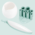Digitaldistribution375 makeup brush cleaner set with white bowl, mint green handle, and silicone brush attachment stand.