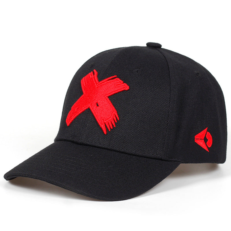 Black baseball cap with a bold, distressed red "X" embroidery on the front and a small red logo on the side.
