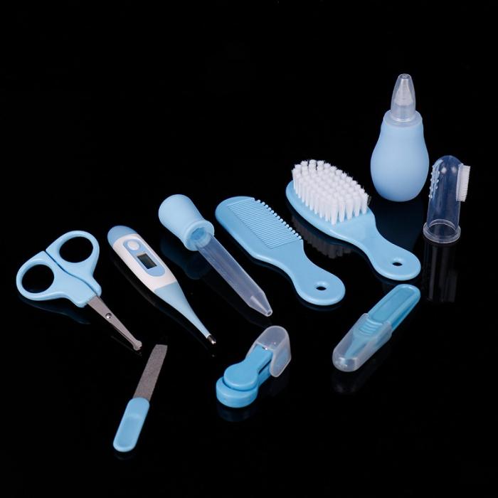 Blue baby grooming kit: scissors, thermometer, dropper, comb, brush, nasal aspirator, finger toothbrush, and clippers.